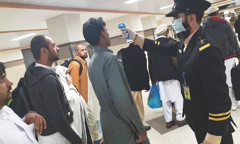 Two additional travelers at Karachi airport confirm positive for COVID-19.