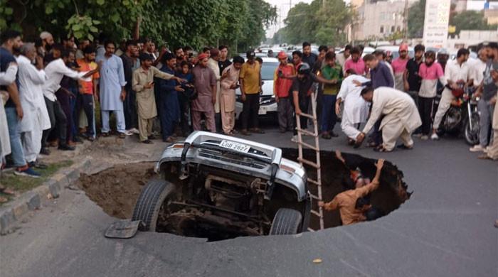 Massive Sinkhole in Lahore Engulfs Three Vehicles, Leading to Major Traffic Disruptions